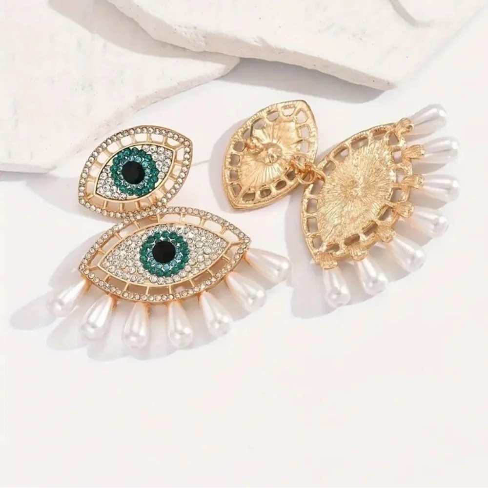 Elegant Gold and Pearl Eye Earrings